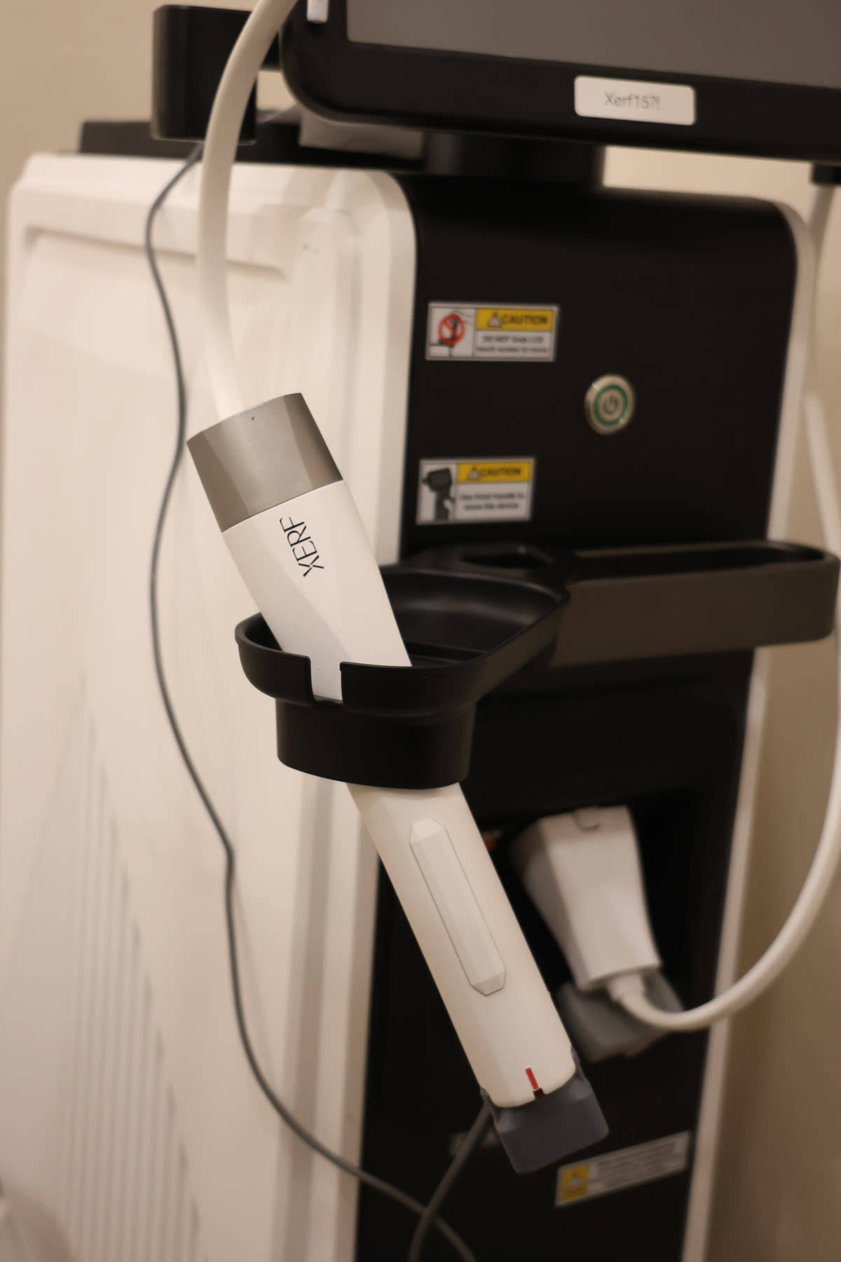 The XERF handpiece resting on the device at Lè Unique Skinlab